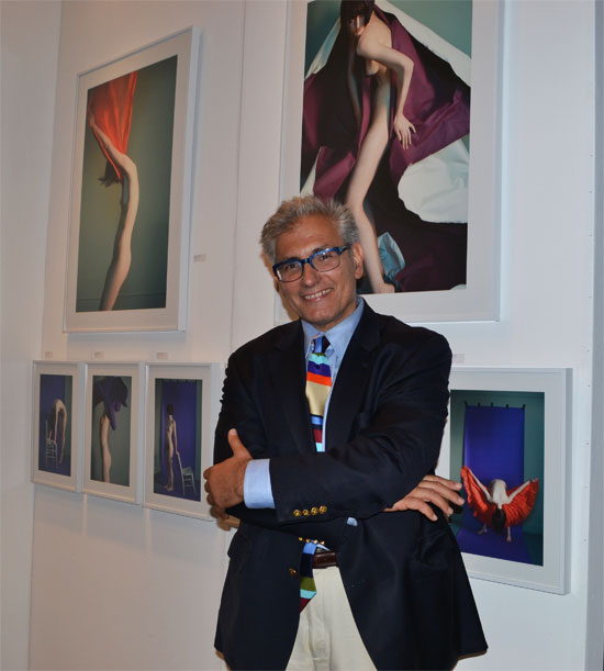 Rick Friedman, founder and executive director of Hamptons Expo Group who produced ArtHamptons at the art fair. Behind him are photographs by Sophie Delaporte, exhibited with Sous Les Etoilles Gallery. 