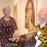 Cindy Sherman and Chuck Close share a moment in front of her portrait (behind Close and not seen) exhibited at Guild Hall.