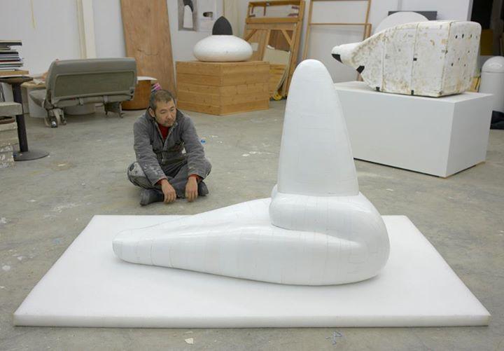 Artist Hiroyuki Hamada with his "#72, 76", 2010-13. Painted resin, 28 x 53 x 39 inches. Courtesy of the artist.