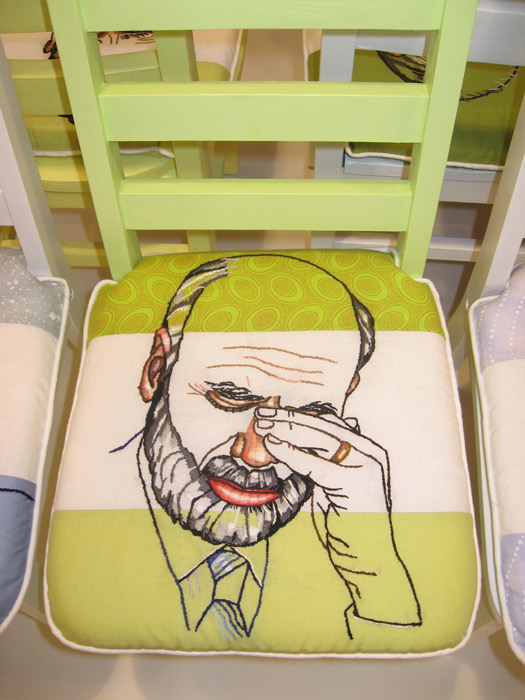 "Ben Bernanke, Musical Chairs - Economic Crisis in G Minor" by Christa Maiwald, 2009. Six children's chairs, hand-embroidered cushions, installation dimensions vary, photo by Gary Mamay.