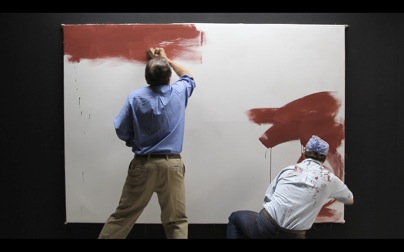 Victor Slezak as Mark Rothko and Christian Scheider as Rothko's assistant, Ken, apply ground color. Photo by Brian Leaver. Courtesy Guild Hall.