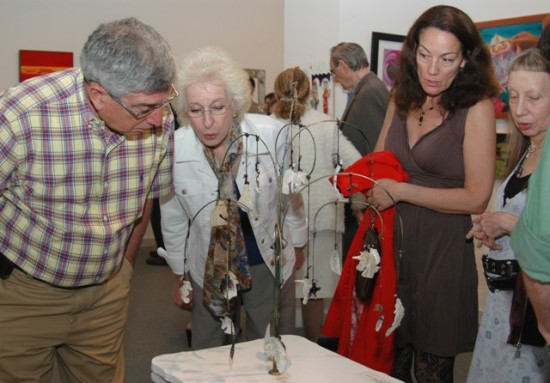 Viewing art at the opening of the 2011 "Guild Hall Artists Members Exhibition". Photo by Pat Rogers.