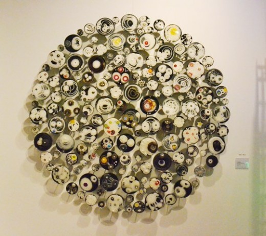 Hypochondria Noir, 150 by Klari Reis. Mixed media. Petri Dishes, Tee Nuts and Steel Rods, 60 inches diameter. Exhibited The Cynthia Corbett Gallery