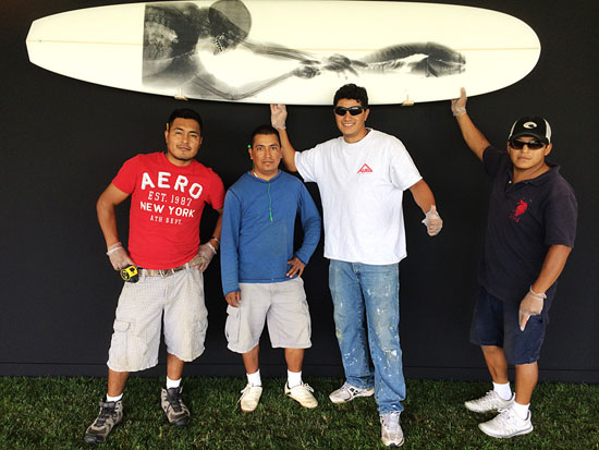 "Black Selfie on White 016" by Steve Miller, 2014, installed at the "Surf Shack". Long Board Diamond Tail Single Fin, 108 x 22.75 inches. Photo courtesy of the artist.