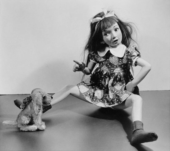 "Young Girl with Bow and Dress and Stuffed Dog" by Morton Bartlett, 1950, printed 2012. Unique digital print, 14 x 11 inches. Courtesy of Marion Harris, NY. 