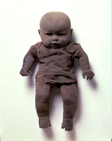 "Dirt Baby" by James Croak, 1986. Cast dirt, 15 x 9 x 5 inches. From the collection of Barbara Bloemink.