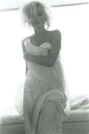 "Marilyn with bed sheet" by Bert Stern.