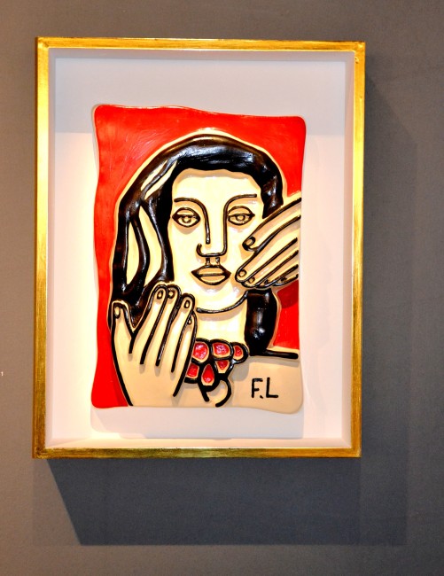 "Visage aux Deux Mains Fond Rouge" by Fernand Leger, 1953-54. Ceramic with painted polychrome, 18 1/8 x 12 3/4 inches. Original Edition No. 12. 