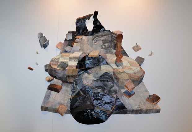 "Body on Table with Deep Black Space" by Yashua Klos, 2015. Collage of woodblock prints on archival paper, 205 x 167 cm