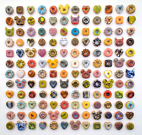 "Donut Rush" installation by Jae Yong Kim, 2015. Fired clay, glaze and underglaze, swarovski crystals, white gold and gold luster glaze, 4 x 4 x 1.5 inches (each). 