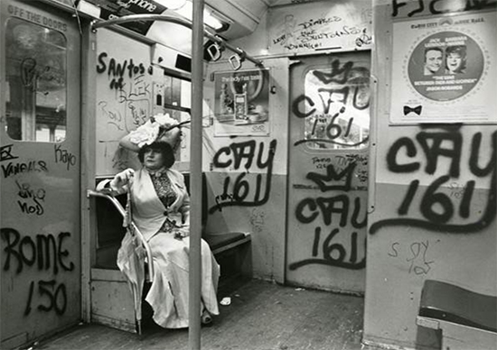 Editta Sherman riding a 1970’s era NYC subway car to a shoot. Photo by Bill Cunningham. 