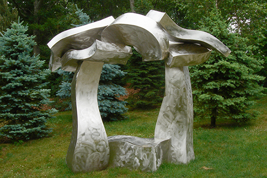 "Sagg Portal With Bench" by Hans Van de Bovenkamp, 2005 & 2006. Stainless Steel, 9'H x 10'W x 5'D. 