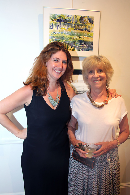 Curator Andrea McCafferty and artist Cynthia Sobel with "Blue Poles." Photo by Tom Kochie.