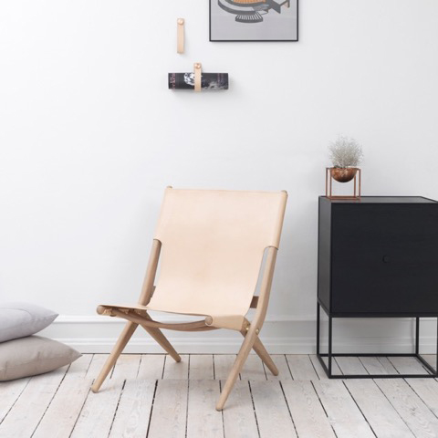 By Lassen ‘Saxe’ chair in pale, brown or black leather.