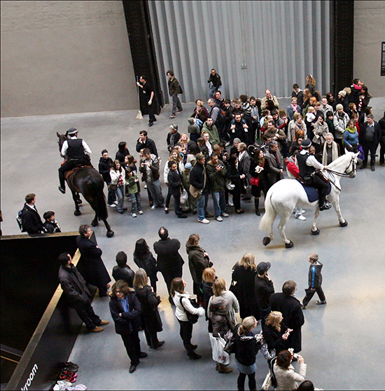 "Tatlin’s Whisper #5" by Tania Bruguera. Mounted police, crowd control techniques, audience, overall dimensions variable Installation view: UBS Openings: Live the Living Currency, Tate Modern, London, 2008 Photo: Sheila Burnet. Courtesy the artist.