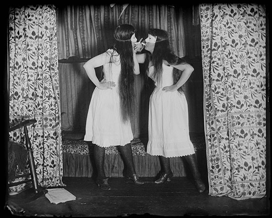 "Trude and I, Masked, Short Skirts" by Alice Austen, 1891. Collection of Historic Richmond Town in collaboration with the Alice Austen House.