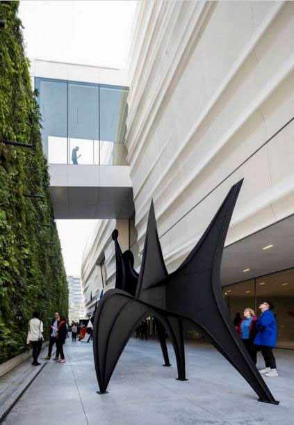 Pat and Bill Wilson Sculpture Terrace featuring Alexander Calder’s "sculpture Maquette for Trois Disques (Three Disks), formerly Man" (1967) and the living wall, designed by Habitat Horticulture. Photo: © Henrik Kam, courtesy SFMOMA.