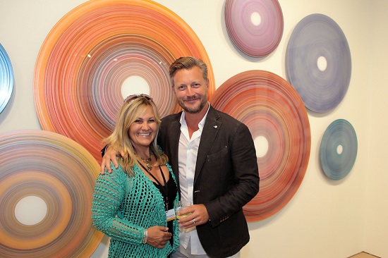Gallerist Bonnie Edwards of Chase Edwards Gallery with exhibiting artist Christopher Martin. Photo by Tom Kochie.