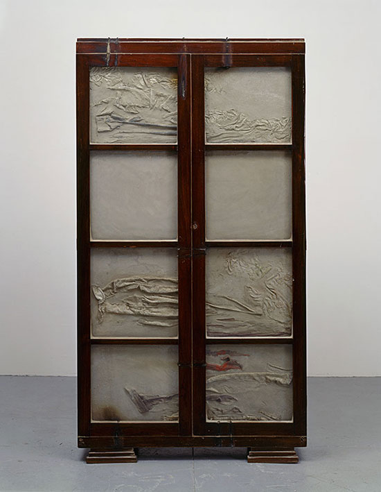 "Untitled" by Doris Salcedo, 1998. Wooden cabinet, concrete, steel, glass and clothing 721⁄4 x 39 x 13 inches. Collection of Lisa and John Miller, fractional and promised gift to the San Francisco Museum of Modern Art. Photo: David Heald.