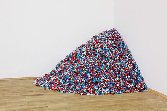 "Untitled" (USA Today) by Felix Gonzalez-Torres, 1990. Candies individually wrapped in red, silver, and blue cellophane, endless supply. Installation view of "Felix Gonzalez-Torres: Specific Objects without Specific Form," Museum Für Moderne Kunst, Frankfurt, Germany, January 28 - March 14, 2011. © The Felix Gonzalez-Torres Foundation, courtesy of Andrea Rosen Gallery, New York.