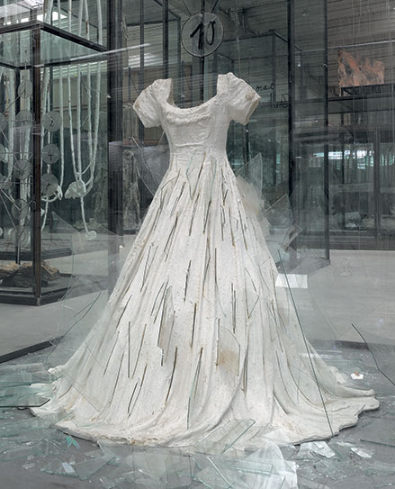 "Die Schechina" by Anselm Kiefer, 2010 (detail). Painted resin dress, glass shards, steel, numbered glass discs, and wire ininscribed glass and steel vitrine, 179 x 82.5 x 82.5 inches. Hall Collection, Courtesy Hall Art Foundation. Photography: Charles Duprat. © Anselm Kiefe. Image courtesy of NSU Art Museum Fort Lauderdale. 
