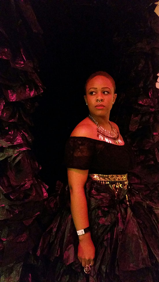 Performance artist Taja Lindley inside her immersive video installation "This Ain't A Eulogy - A Ritual for Re-Membering" at Spring / Break. Photo by Pat Rogers.