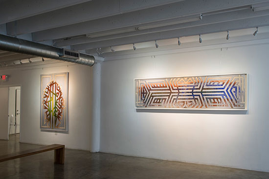"Sublimation: Ancestral Patterns" by Ya Levy La'ford at Yeelen Gallery. Foreground: "Fang." Courtesy of Yeelen Gallery.