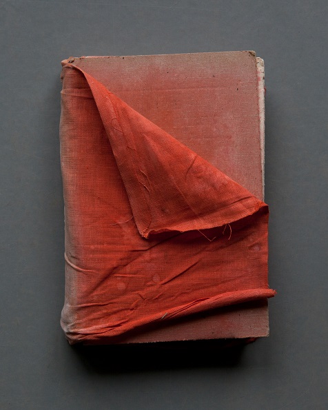 "Red Cloth Cover (Reading Grey Gardens)" by Mary Ellen Bartley, 2017. Archival pigment print, 18 3/4 x 15 inches (image), 20 3/4 x 17 inches (sheet), Edition of 7. Courtesy The Drawing Room.