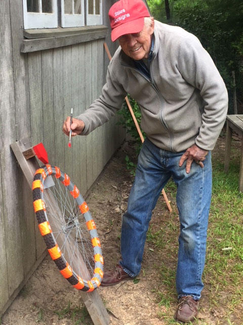 David Stiles adding the finishing touches to the try-your-luck wheel. Courtesy of East Hampton Chamber of Commerce.