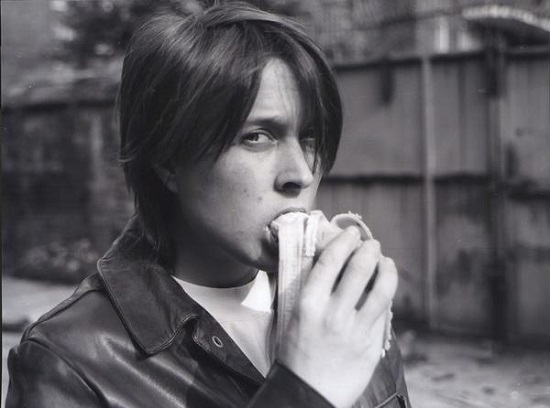 "Eating a Banana" by Sarah Lucas 1990. Black-and-white photograph, 41 3/8 x 44 3/8 inches. © Sarah Lucas. Courtesy Sadie Coles HQ, London. and New Museum, New York.