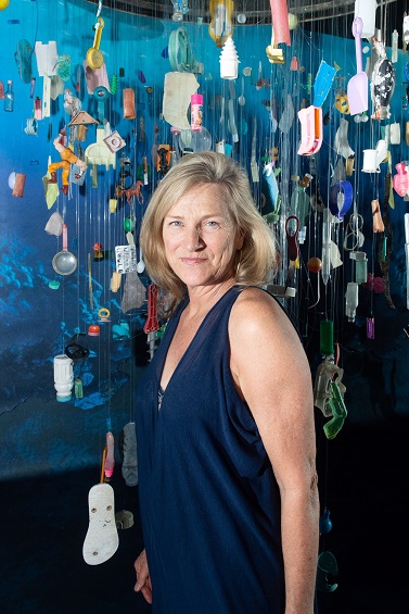 Artist, Cindy Pease Roe in front of her artwork “Pieces of You: Much Ado About Something", 2018. On view at Acadia.Earth in Miami. Courtesy of the artist.