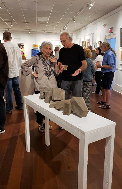 Discussing art after examining Bo Parsons fired ceramic sculpture "Architectural Fragments". Photo: Pat Rogers. 