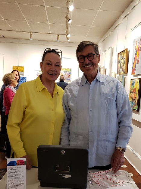 Springs Improvement Society board members Elizabeth Meredith and Ira Barocas take a moment from welcoming guests at the Opening Reception of SIS's "Members Art Show." Photo: Pat Rogers. 