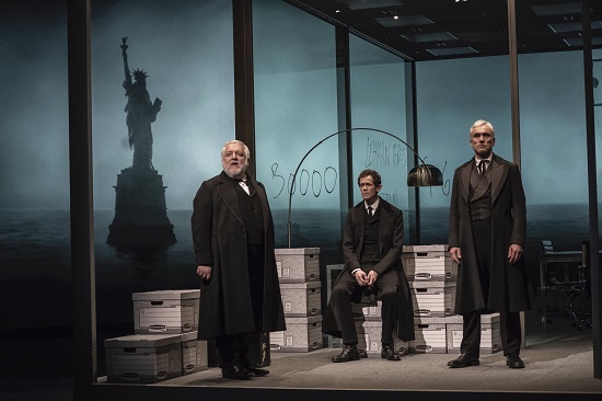 The Park Avenue Armory Presents "The Lehman Trilogy" directed by Sam Mendes, at the Park Avenue Armory, during a dress rehearsal, on March 21, 2019. North American Premiere by Stefano Massini. Sam Mendes, Director, Es Devlin, Set Designer, Katrina Lindsay, Costume Designer. Luke Halls, Video Designer, Jon Clark, Lighting Designer. Starring Simon Russell Beale, Adam Godley, and Ben Miles. Credit: Stephanie Berger. Courtesy Guild Hall.